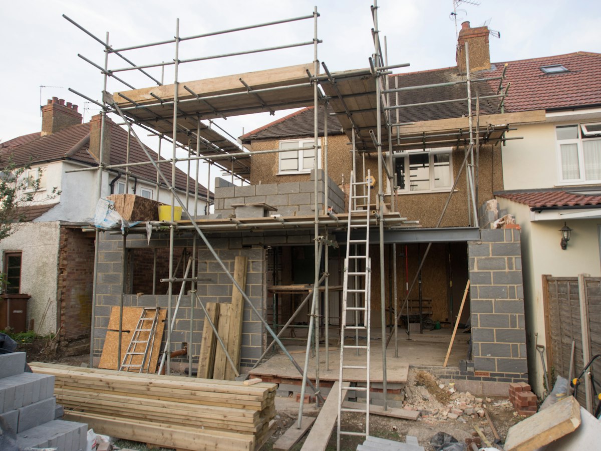 Scaffolding ladder against a house under renovation
